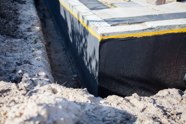 Professional Basement Waterproofing technician working in Mill Creek, WA